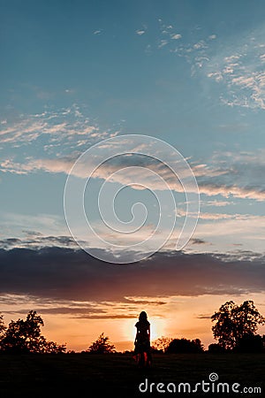 Silhouette of Person at Sunset Stock Photo