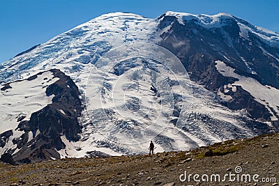 Silhouette of a person walking in Mount Rainier Editorial Stock Photo
