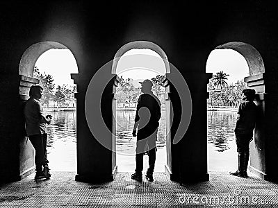 silhouette of 3 persons in a Historical place Editorial Stock Photo