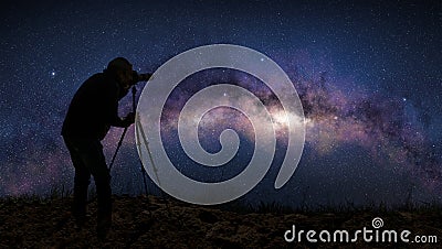 Silhouette of a photographer shooting the milky way Stock Photo