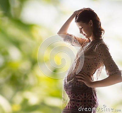 Silhouette picture of pregnant beautiful woman Stock Photo