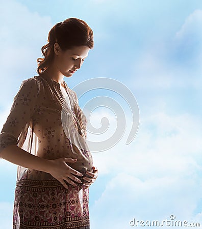 Silhouette picture of pregnant beautiful woman Stock Photo