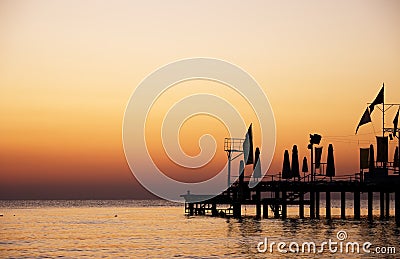 Silhouette pier with beautiful sunrise sky Stock Photo
