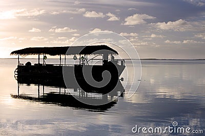 Silhouette of Polynesian boat mooring on Muri lagoon Muri lagoon Stock Photo