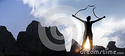 Silhouette of a woman with broken chains Stock Photo