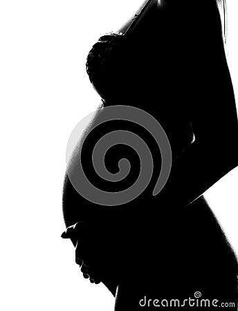 Silhouette of pregnant woman Stock Photo