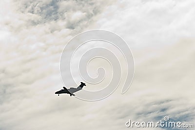 Silhouette, private, luxury, twin engine jet, landing Stock Photo