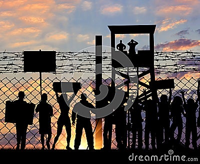 Silhouette protesting refugees near the border Stock Photo