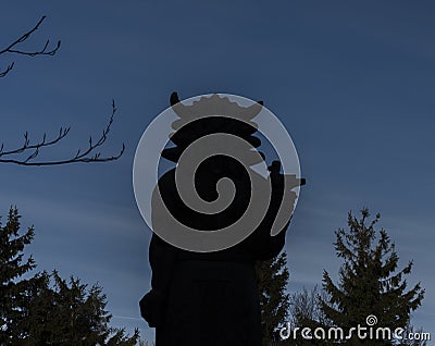 Silhouette of Radegast statue on road between Pustevny and Radhost hill Stock Photo