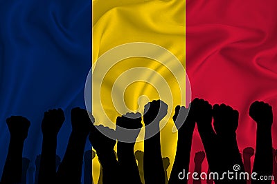 Silhouette of raised arms and clenched fists on the background of the flag of Romania. The concept of power, power, conflict. With Stock Photo