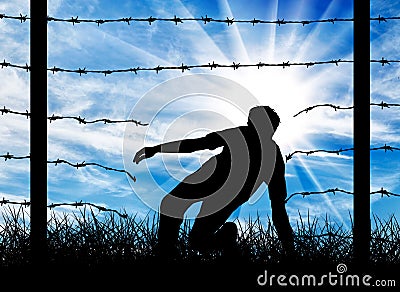Silhouette of a refugee who illegally cross the border Stock Photo