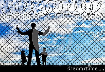 Silhouette refugees father and two children Stock Photo