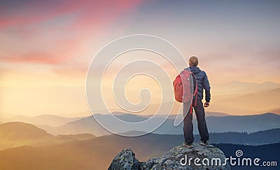 Silhouette of a rock climber at the mountain valley background. Stock Photo