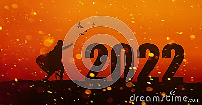 Silhouette running across the target Soar to 2022 with determination and confidence. Reaching a better goal success concept Stock Photo