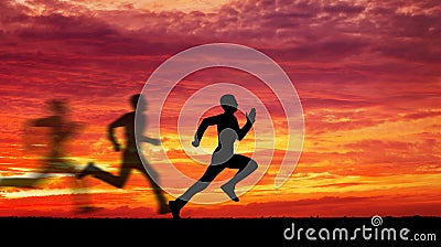 Silhouette of running man against the colorful sky. Stock Photo