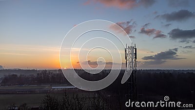 silhouette satellite dish cell tower telecom network at sunset communication technology network Stock Photo