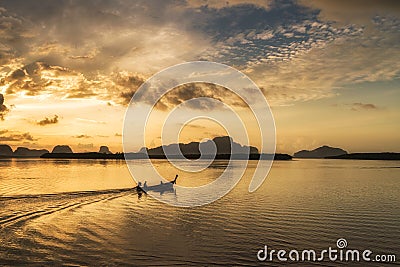 Silhouette scene of long-tail boat morning sunrise Stock Photo