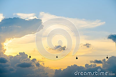 Silhouette of singapore cable car transportation to sentosa island on the evening Stock Photo