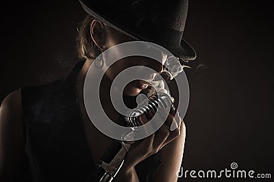 Silhouette singer woman with retro microphone Stock Photo