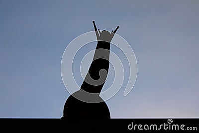 The silhouette of a snail raising its head against the blue sky Stock Photo
