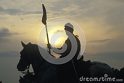 Silhouette of soldier on horseback with gun during reenactment of Battle of Manassas marking the beginning of the Civil War Editorial Stock Photo