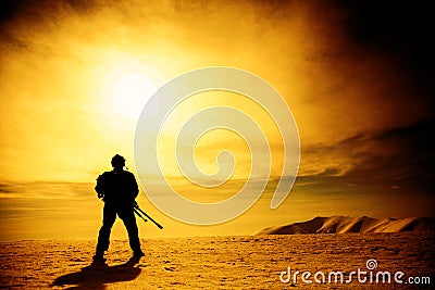 Silhouette of soldier with sniper rifle Stock Photo