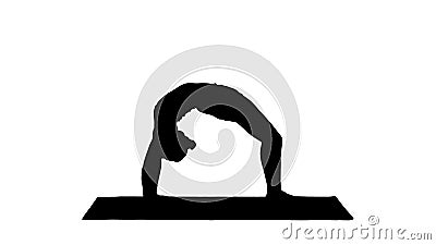 Silhouette Sporty yoga girl performing Chakrasana Urdva Dhanuras Stock Photo