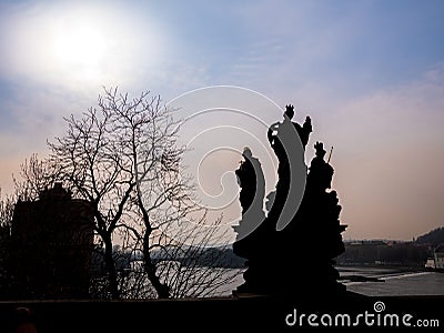 Silhouette statue charles bridge prague czech republic beautiful sky and tree. Stock Photo