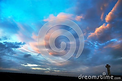 Silhouette of stone cross Stock Photo