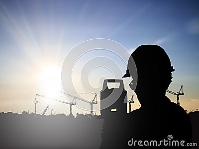 Silhouette Successful male engineer standing survey work on cons Stock Photo