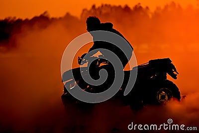 Silhouette summer offroad adventure on atv in sand Stock Photo