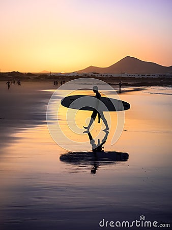 Silhouette of a Surfer on Famara beach at sunset Editorial Stock Photo