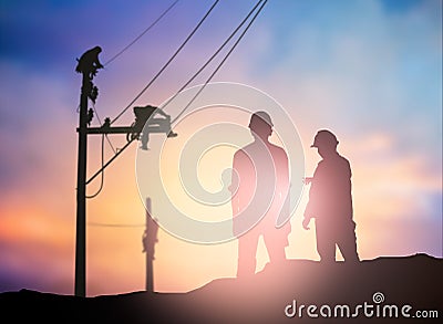 Silhouette survey engineer working in a building site over Blur Stock Photo