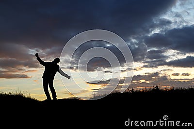 Silhouette of a swinging man against the sunset, lonely man Editorial Stock Photo