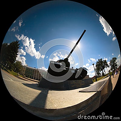 Silhouette of a tank that covers the sun with its muzzle. Editorial Stock Photo