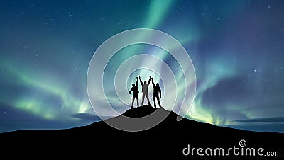 Silhouette of a team at the northen light background. Stock Photo
