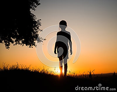 Silhouette of a teen girl Stock Photo