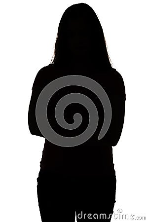 Silhouette of teenager with arms crossed Stock Photo