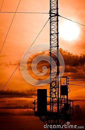 Silhouette telecommunication pole Stock Photo