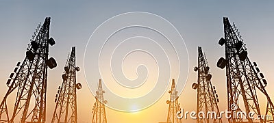 Silhouette, telecommunication towers with TV antennas and satellite dish in sunset, panorama composition Stock Photo