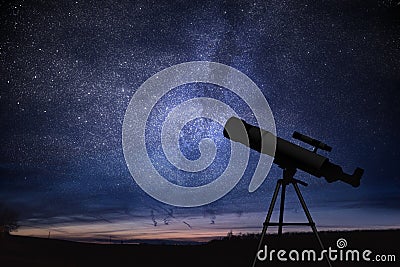 Silhouette of telescope and starry night sky in background. Astronomy and stars observing. Stock Photo