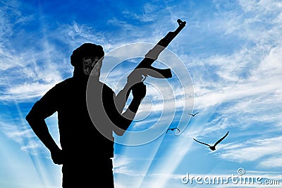 Silhouette of a terrorist with a weapon Stock Photo