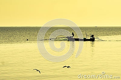 Silhouette Thai Fisherman going on ocean on traditional fishing Editorial Stock Photo