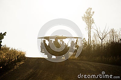 Silhouette of Thai people use tractor for service travelers tour Phu Pa Po mountain or Fuji City Loei Editorial Stock Photo