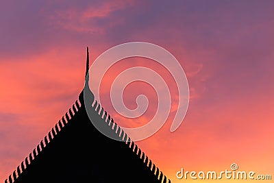 Silhouette Thai style temple roof and sunset Stock Photo