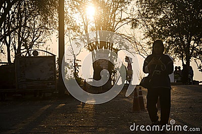 Silhouette of thai woman and travelers people visit and looking Editorial Stock Photo
