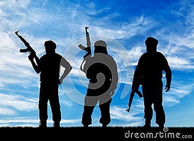 Silhouette of three terrorists Stock Photo