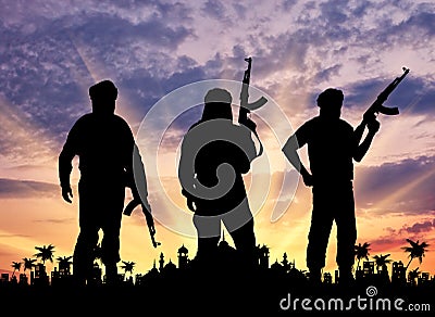 Silhouette of three terrorists Stock Photo