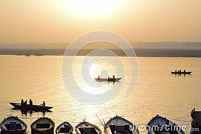 Silhouette tourist boats at Ganges river in Varanasi, India at sunrise Editorial Stock Photo