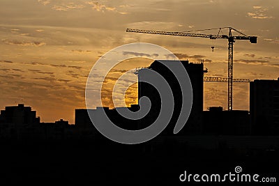 Silhouette of a tower crane Stock Photo